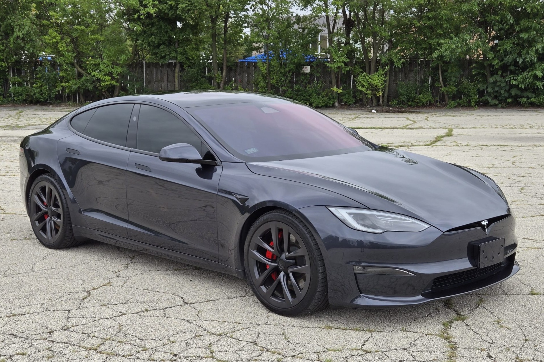 This 2023 Tesla Model S Plaid was purchased new by its owner and is powered by three AC induction motors that drive all four wheels. Finished in gray over white upholstery, the car is equipped with Plaid-specific bodywork, a panoramic glass roof, gray-finishe…