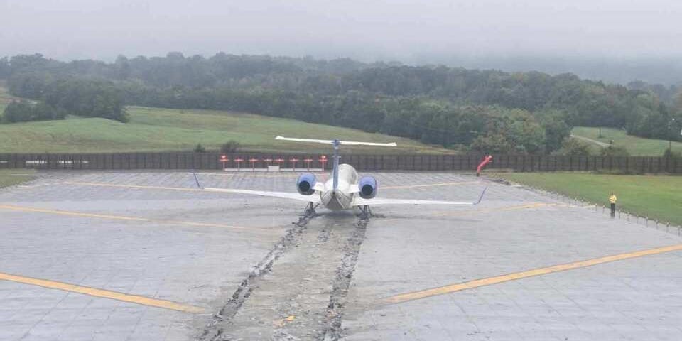 A CommuteAir plane skidded off the runway and into a tire ditch despite two go-around calls from the aircraft's first officer.