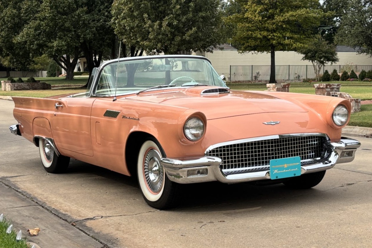 This 1957 Ford Thunderbird is finished in Coral Sand over Colonial White vinyl and powered by a 312ci V8 mated to a three-speed Fordomatic automatic transmission. Equipment includes a Colonial White-finished removable hardtop, a convertible top, power-assiste…