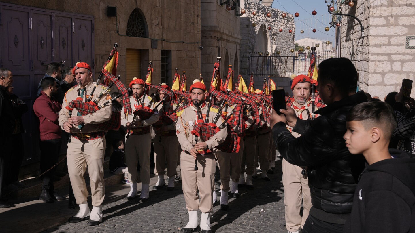 After two years of subdued Christmas celebrations due to war in Gaza, thousands of people have flocked to Bethlehem's Manger Square on Christmas Eve. The giant Christmas tree returned, and scouts groups marched and played festive music. Bethlehem canceled cel…