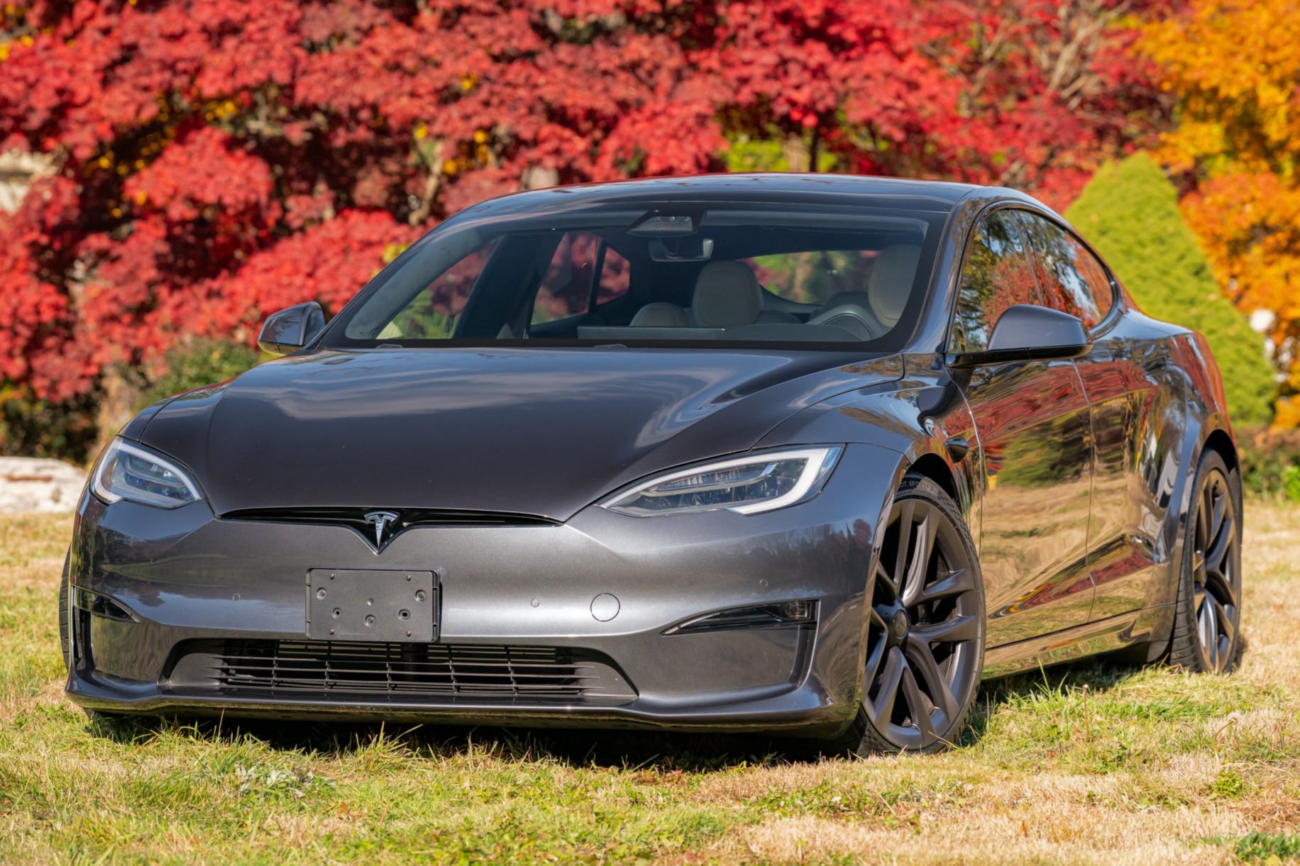 This 2021 Tesla Model S Plaid was purchased new by the current owner and now has 4,600 miles. Finished in Midnight Silver Metallic over a Cream Premium interior, the car is powered by three AC induction motors driving all four wheels. Equipment includes 21" A…