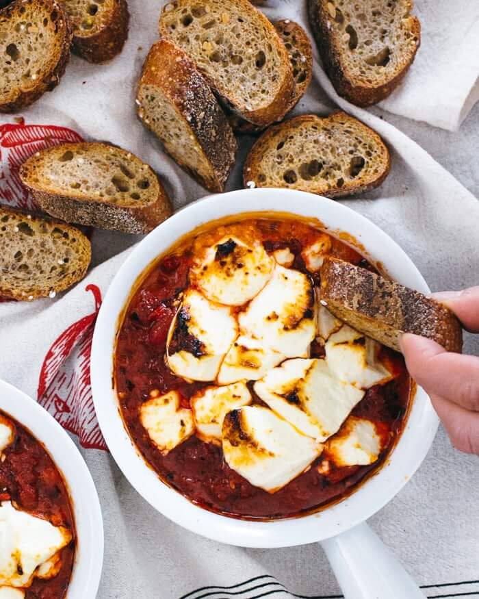 This baked goat cheese brings bold, pizza-like flavor in less than 30 minutes! Creamy tangy goat cheese melts into a garlicky tomato sauce for an irresistible appetizer that disappears fast.