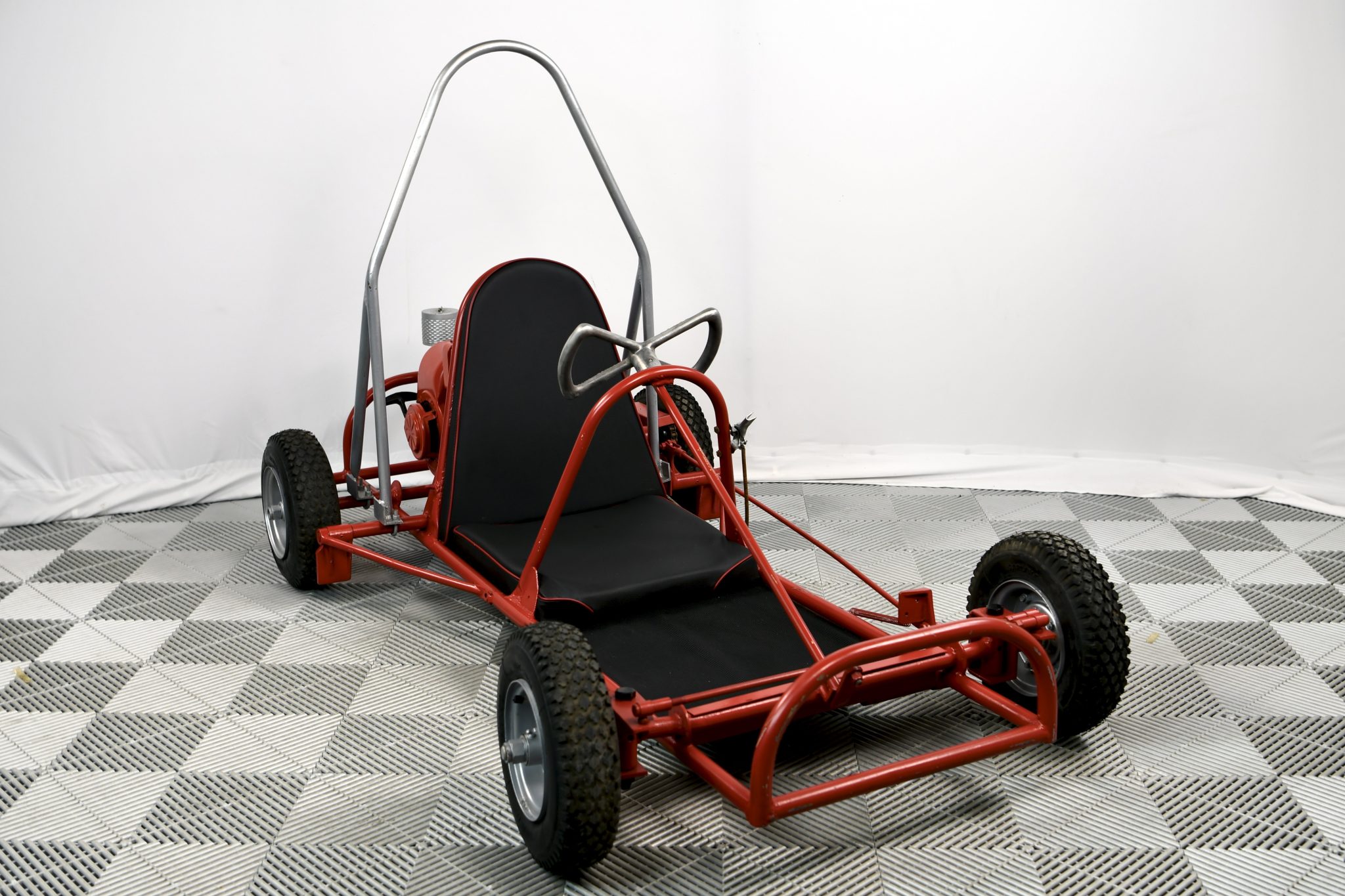 This Pressweld Track Rabbit go-kart was built circa 1960 and was purchased by the seller approximately five years ago. The go-kart features a tubular steel frame finished in red and is powered by a Lauson four-cycle single. Features include a padded black sea…