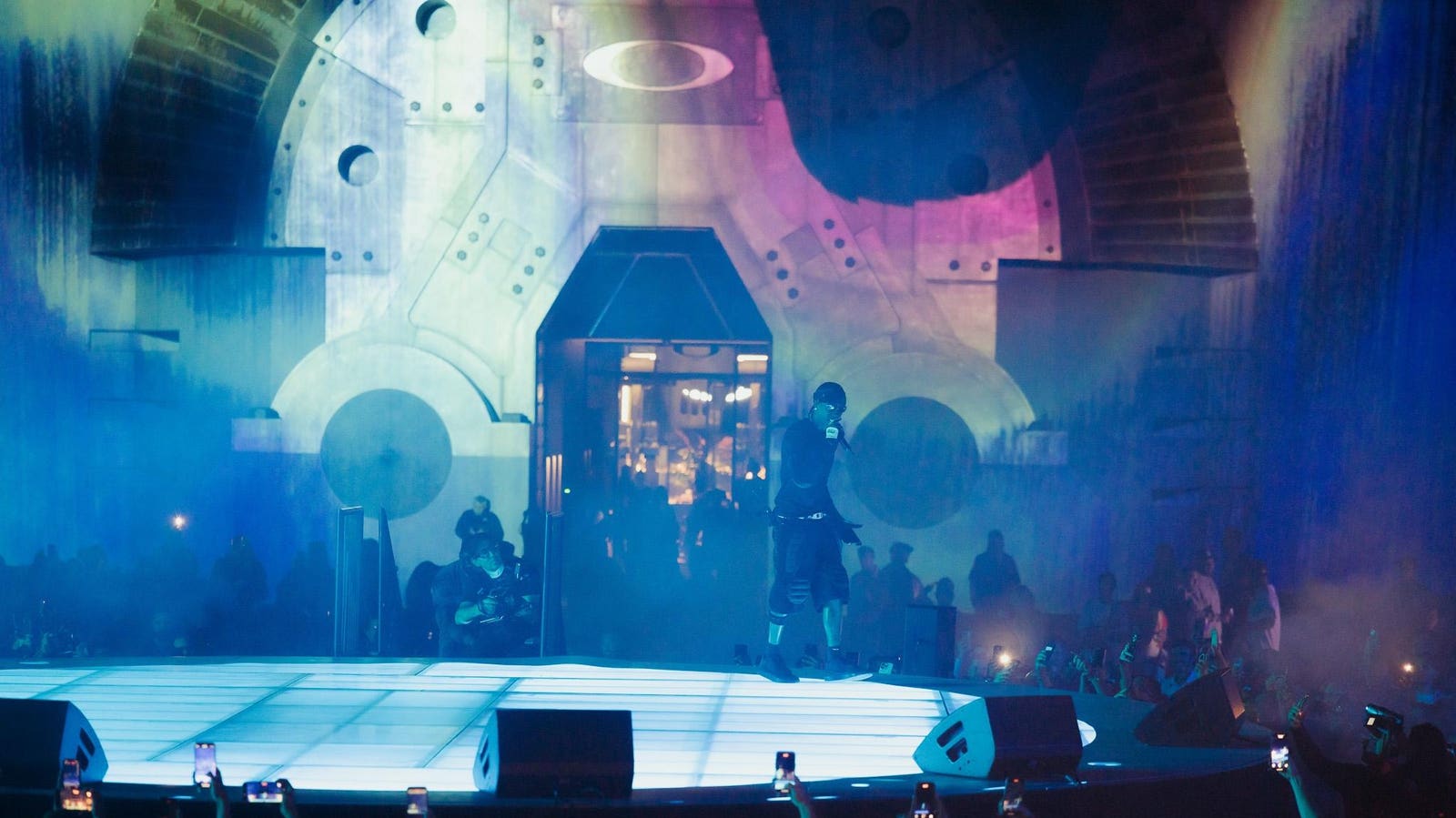 Oakley is looking ahead with Travis Scott as chief visionary, gold-coated sunglasses, AI-powered eyewear with Meta, and a groundbreaking collaboration with Axiom Space.