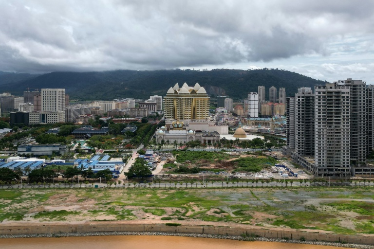Rising from the muddy fields on the Mekong riverbank in Laos, a lotus tops a casino in a sprawling city which analysts decry as a centre for cybercrime.
