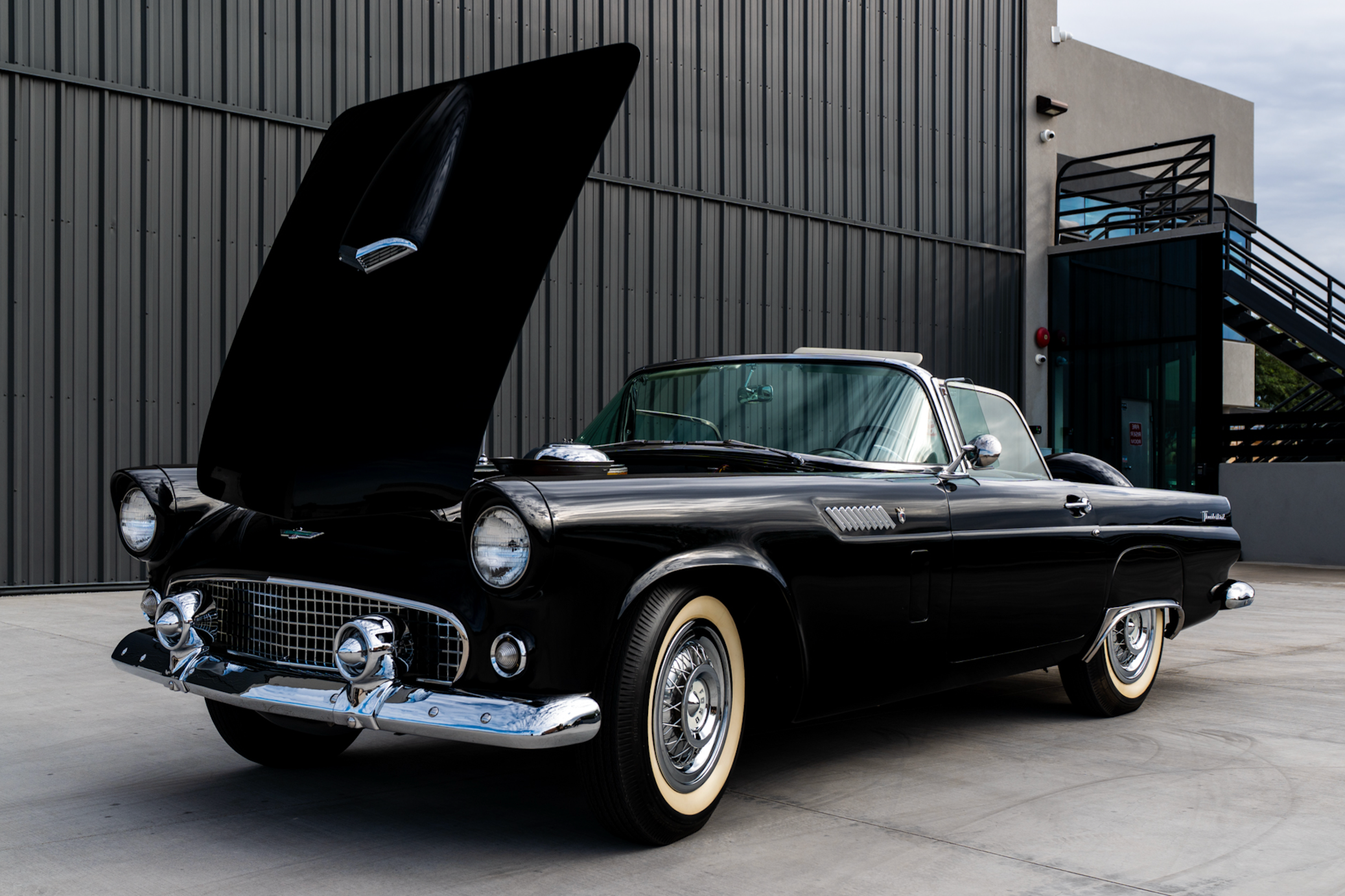 This 1956 Ford Thunderbird is powered by a 312ci Y-block V8 paired with a three-speed Fordomatic automatic transmission. Finished in Raven Black over white and black vinyl upholstery, the car is said to have been refurbished under previous ownership. Equipmen…