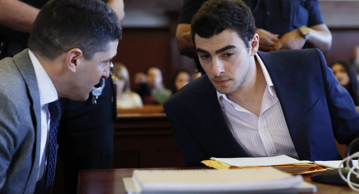 Luigi Mangione (R) appears in Manhattan Supreme Court for a pretrial evidence hearing in the murder case of UnitedHealthcare CEO Brian Thompson, in New York, on December 9, 2025.
 

Mangione’s attorneys argue that the most serious charges against their client…