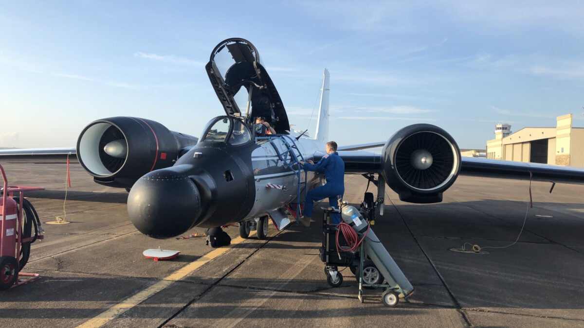 A suspected mechanical issue forced the two-person crew to land the aging aircraft on its belly.