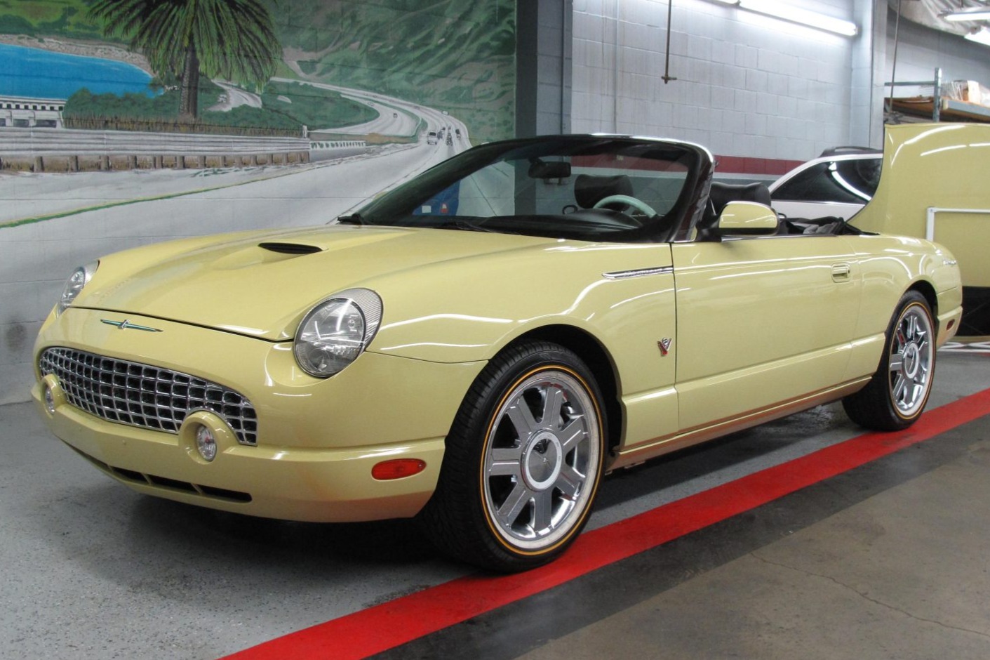 This 2005 Ford Thunderbird is one of 82 finished in Inca Gold and has 50k miles following history in California and Arizona. The car is powered by a 3.9-liter V8 paired with a five-speed automatic transmission. Equipment includes a Midnight Black soft top, a …