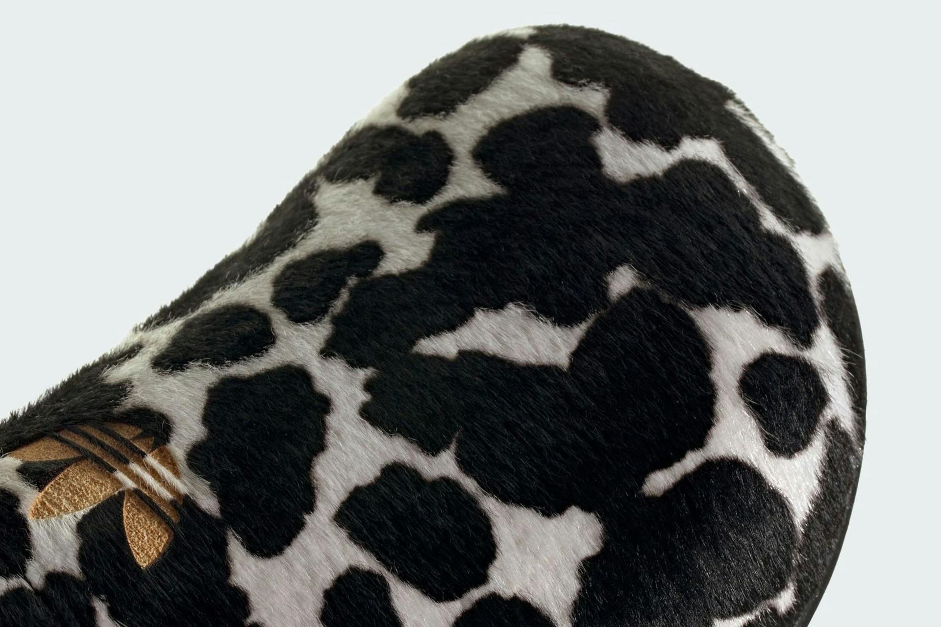 The adidas Adimule clog is back & furrier than ever, thanks to a cow-print fur makeover.