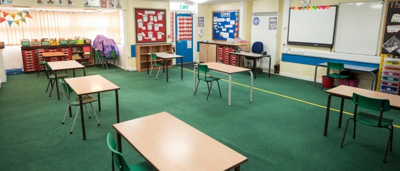 A 13-year-old boy was arrested near a mosque on suspicion of attempted murder Tuesday after two boys were stabbed at a school in London.