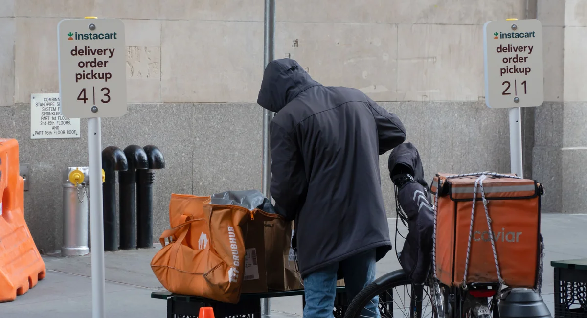 A worker at Instacart delivery order pickup area, outside Wegmans Astor Place.
 

Drivers must be paid at least $21.44 an hour under a law in effect this week. [ more › ]