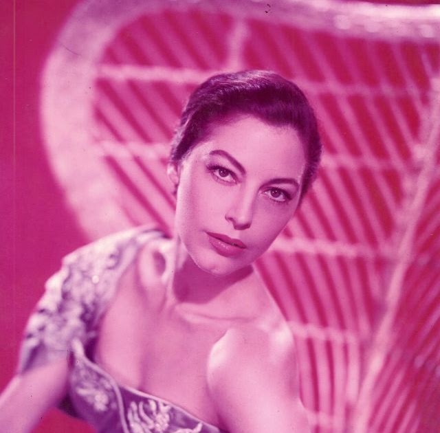Ava Gardner shines with effortless glamour and seductive charm in the 1957 romantic comedy The Little Hut . Cast as the elegant and desirabl...