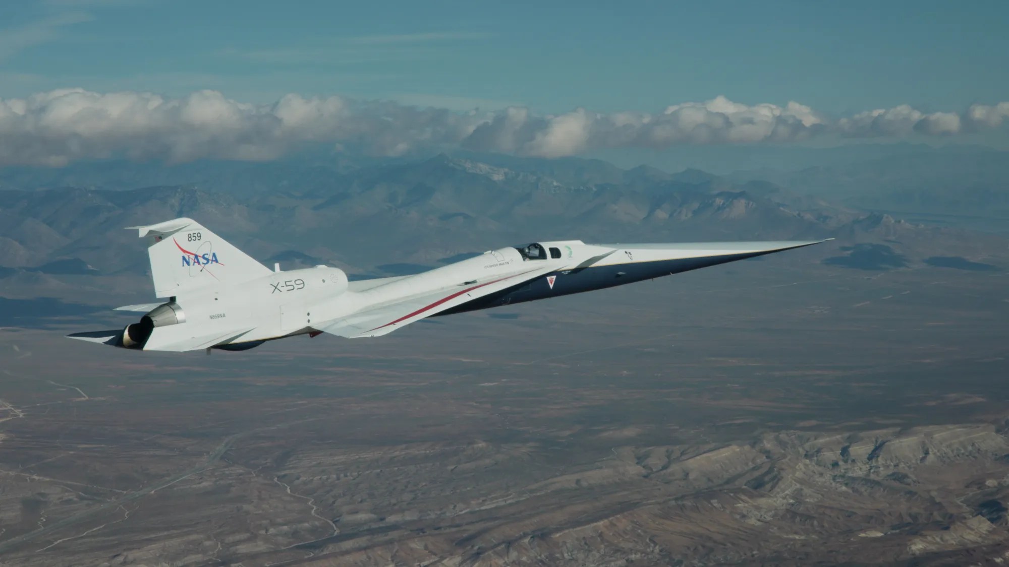 NASA’s X-59 quiet supersonic research aircraft flies over the Mojave Desert in California in this April 14, 2026, image. The transition to flying with wheels up is a key milestone and an important step in the experimental aircraft’s test campaign. The X-59 ha…