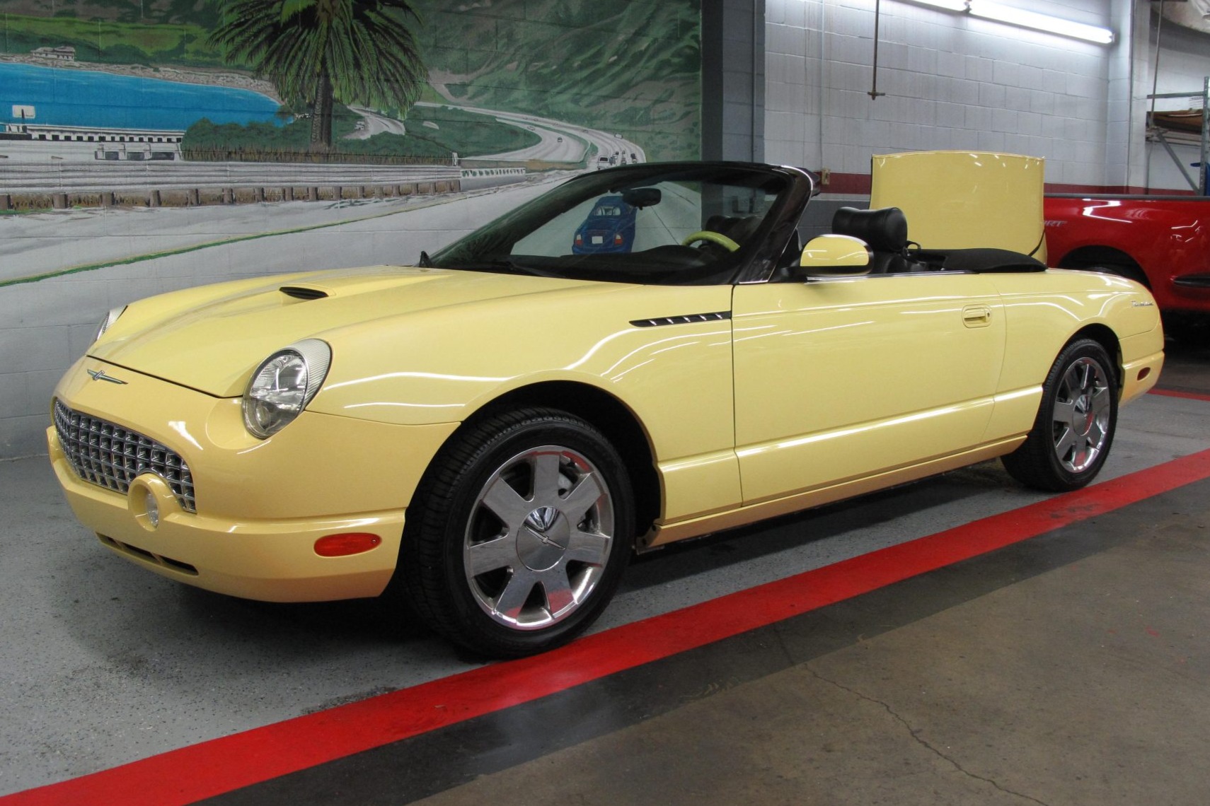 This 2002 Ford Thunderbird was initially delivered to The Ford Store San Leandro in California, and it now has 55k miles following history with a single registered owner. Finished in Inspiration Yellow with a matching removable hardtop, it is powered by a 3.9…