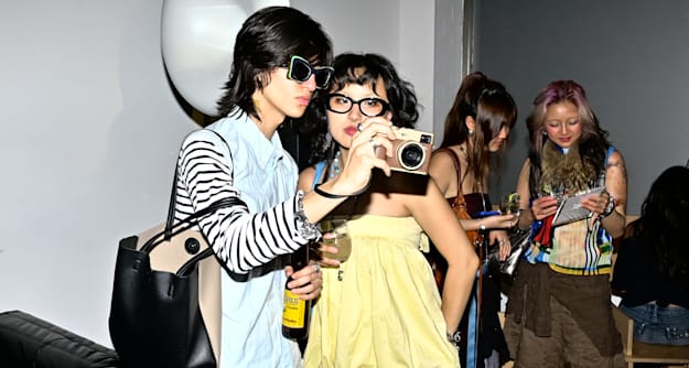 See photos from Perfectly Imperfect x Back Market's Ugly Pretty party that celebrated second-hand laptops and relics like the iPod, original Gameboy, Atari, and more.