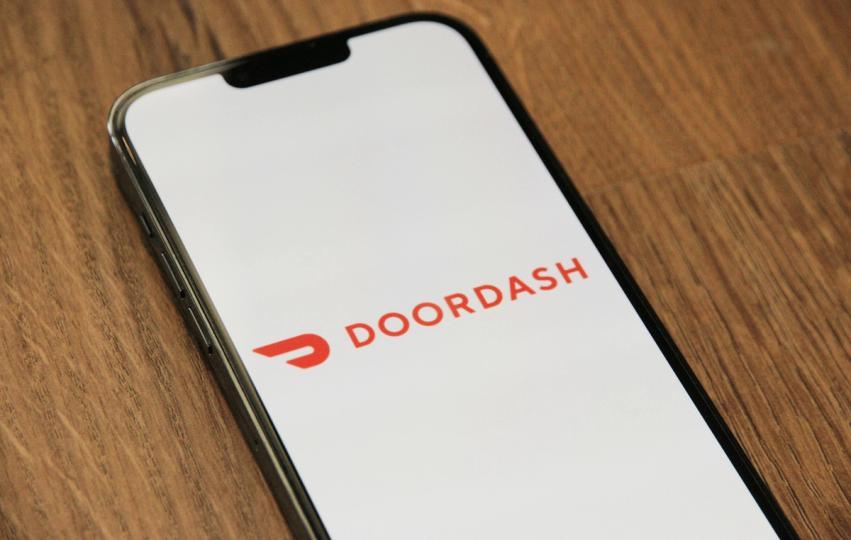 The delivery service is working with the Stripe-led blockchain firm Tempo to bring stablecoin payouts to its global marketplace, replacing fragmented regional rails.