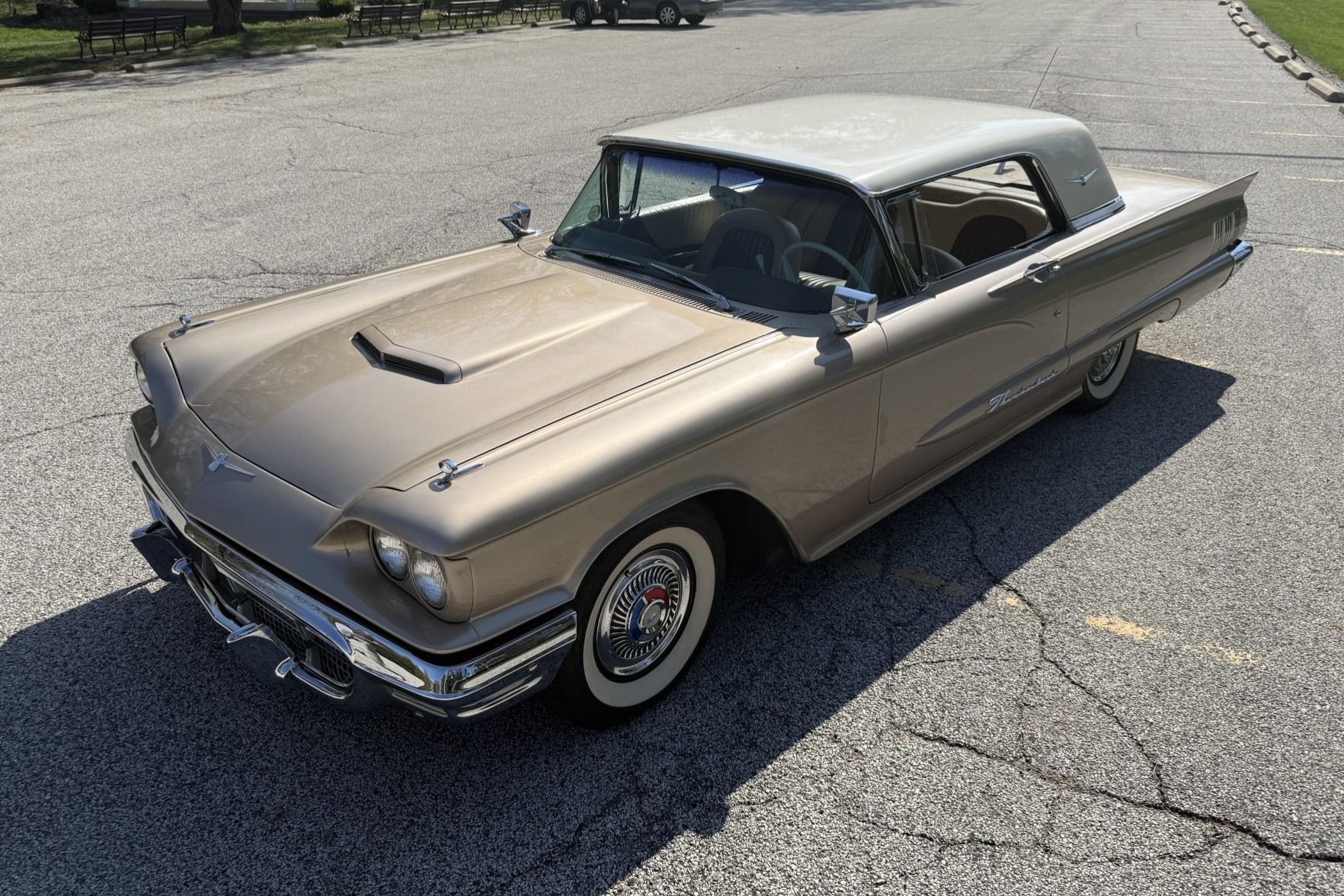 This 1960 Ford Thunderbird coupe is powered by a 352ci V8 paired with a three-speed automatic transmission and is finished in gold and white over tan and brown upholstery. Features include 14" steel wheels, power steering, power-assisted drum brakes, an AM ra…