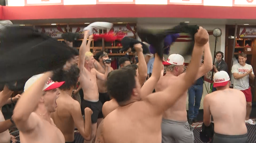 The St. Louis Cardinals surprised a Texas club baseball team behind the viral "Tarps Off" shirtless fan trend at Busch Stadium this weekend, inviting them into the clubhouse for their own shirts-off celebration.