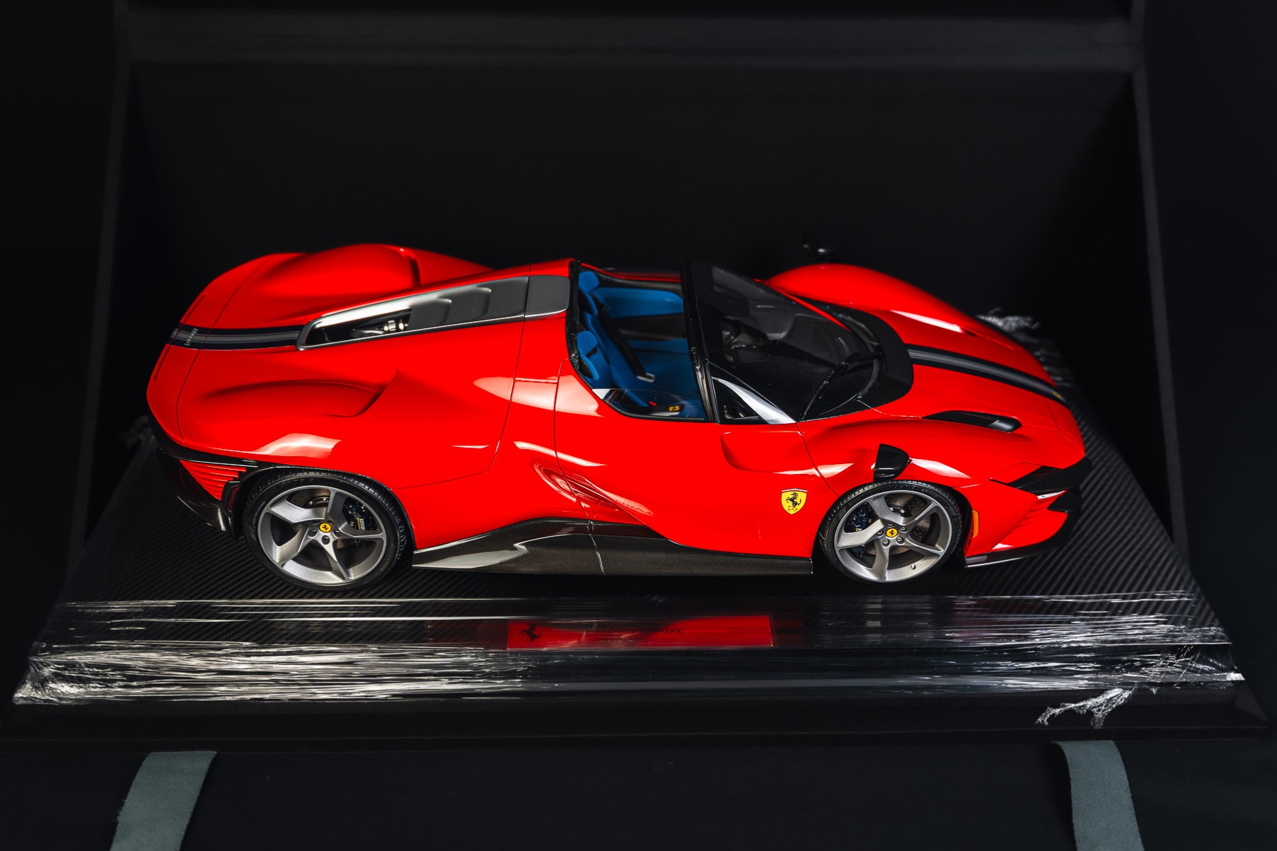 This 1:8 scale model of a Ferrari Daytona SP3 is one of 199 examples produced by Amalgam. The model is constructed of resin and is finished in red over a blue interior. Details include a wraparound windshield, double-crested front wings, mirrors mounted atop …
