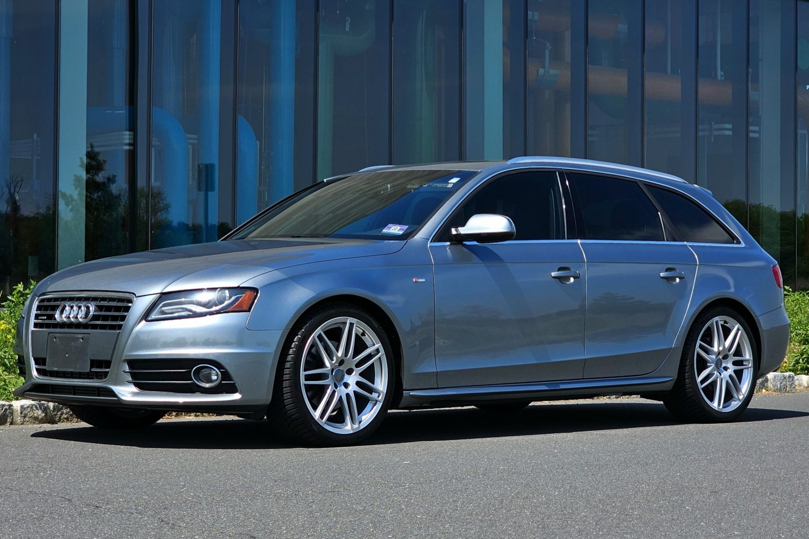 This 2011 Audi A4 Avant Prestige is powered by a turbocharged 2.0-liter inline-four that drives all four wheels through an eight-speed automatic transaxle and a Quattro all-wheel-drive system and is finished in Quartz Gray Metallic over black leather and perf…
